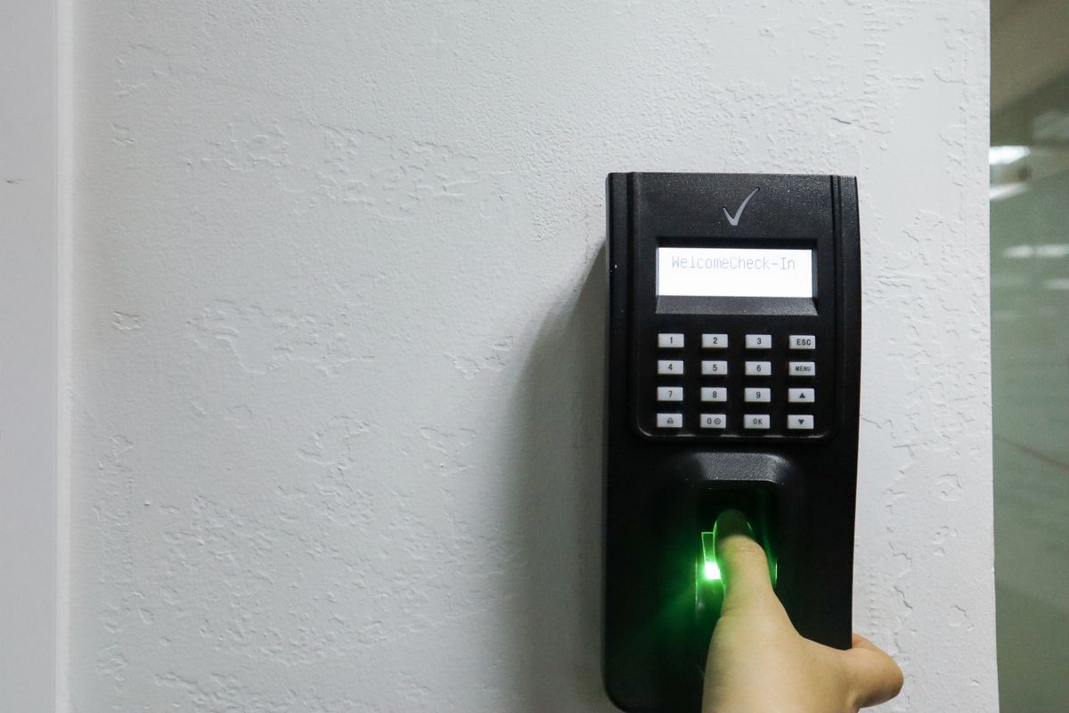 A time keeping machine is placed in front of the company office to calculate the working time for employees.