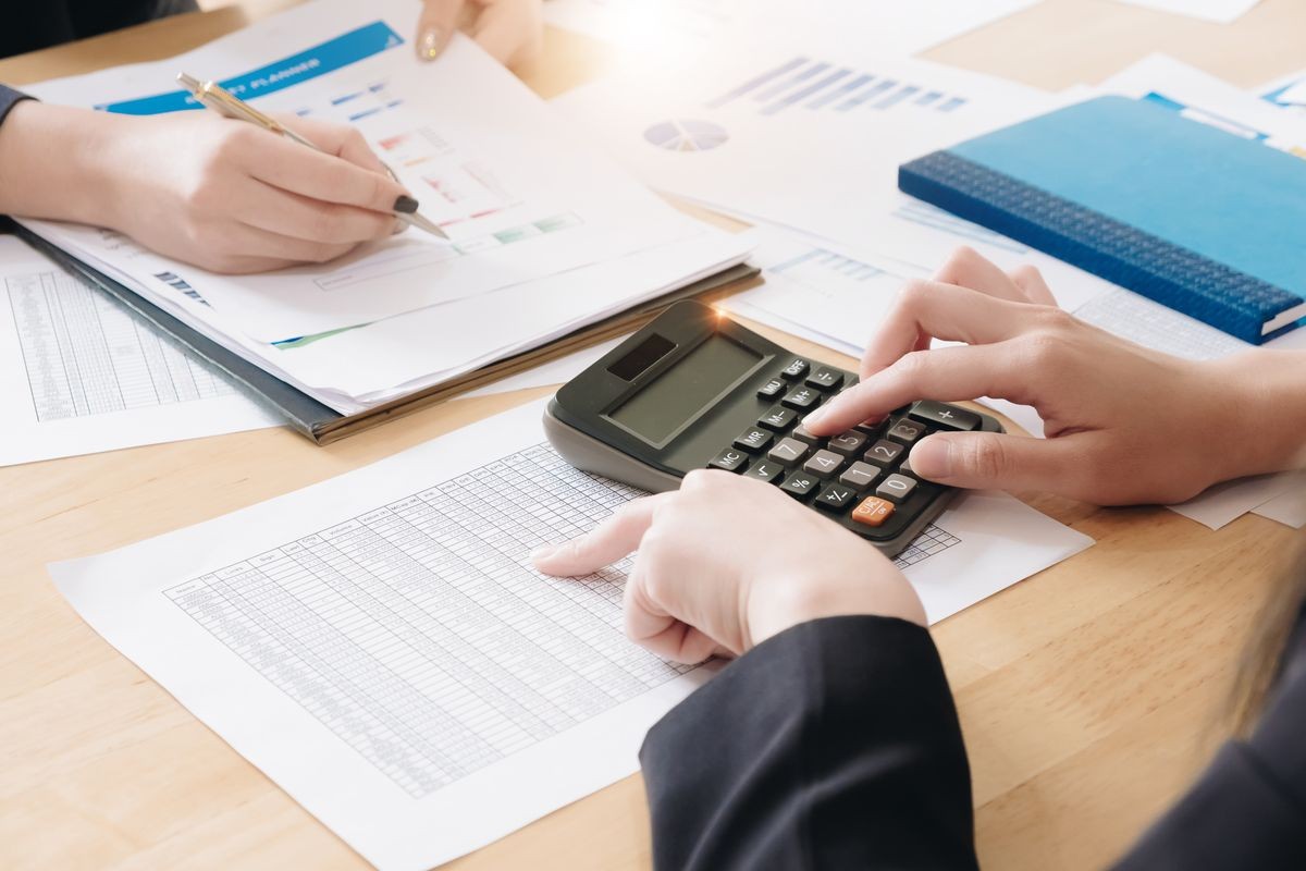 accounting and Investment concept, business owners consult adviser financial meeting to analyze and on the finance report in the his office room. 